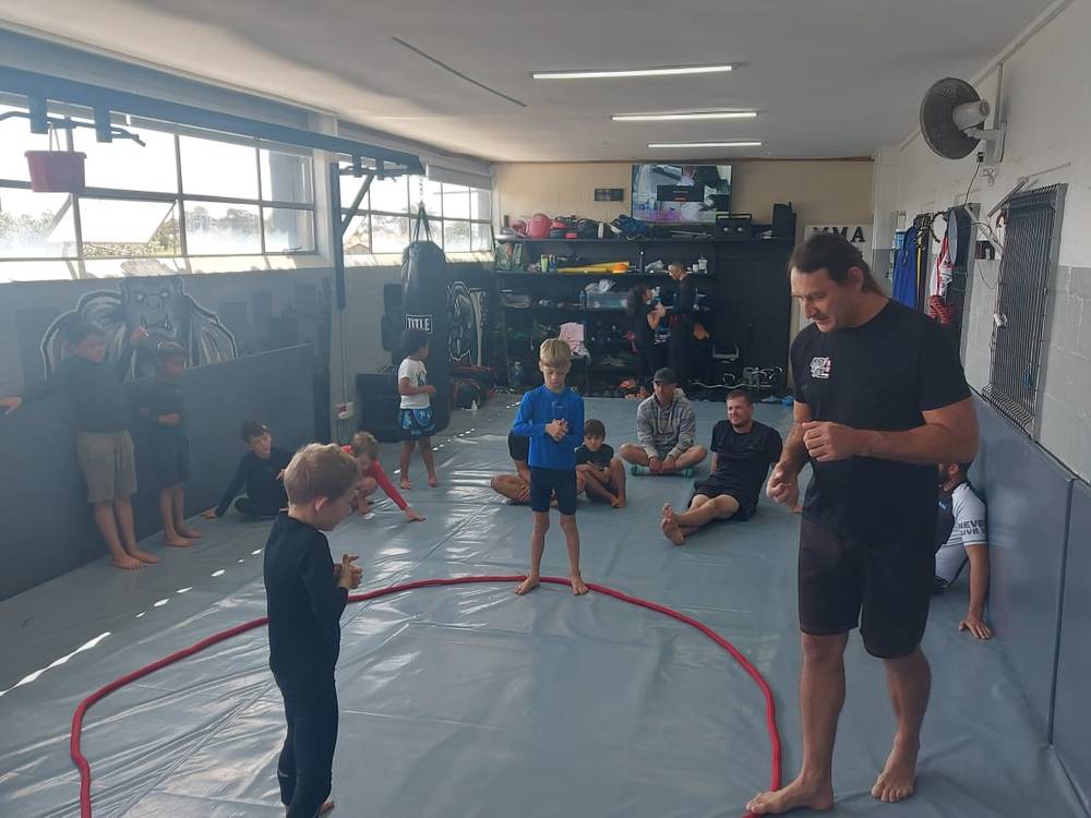 Coach Grant teaching the kids class